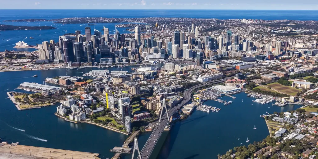 Aerial view of Sydney CBD, harbour, and surrounding areas, featuring the Anzac Bridge, Pyrmont, and Blackwattle Bay precinct.