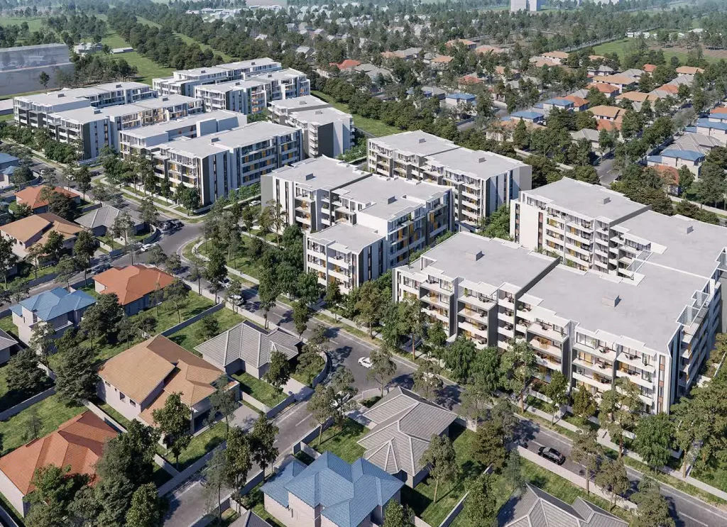 Aerial view of proposed six residential buildings at Tallawong surrounded by greenery and existing suburban homes. The development includes mid-rise apartments with landscaped communal areas and is part of a mixed-use project.