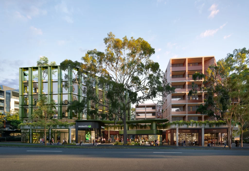 A proposed mixed-use development at 923–935 Bourke Street, Waterloo, featuring a Woolworths supermarket with a modern green façade, retail spaces, and residential apartments surrounded by landscaped greenery and mature trees.