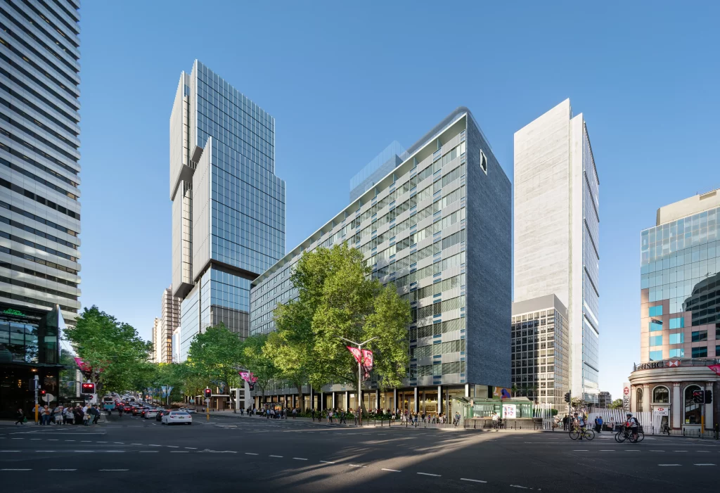 A view of the proposed redevelopment of North Sydney’s heritage-listed MLC Building, featuring the restored Miller Street wing with its iconic curtain wall façade, adjacent to the new modern 22-storey Denison Street wing, surrounded by trees and urban streetscape.