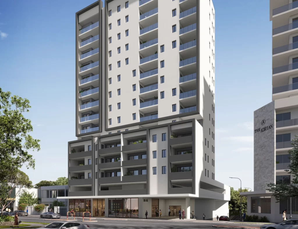 Architectural rendering of a proposed 15-storey mixed-use development at 86-96 Station Street, Wentworthville, featuring residential apartments, commercial spaces, and a childcare centre. The modern building facade includes balconies and a multi-storey base, situated in an urban environment alongside similar high-rise structures.