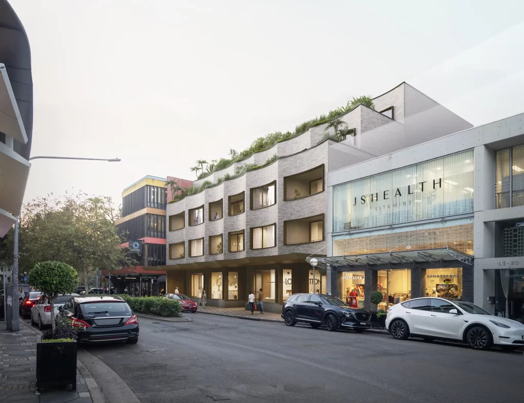 A modern five-storey mixed-use development proposal for 35-45 Knox Street, Double Bay, featuring a curved façade with greenery integrated into terraces. The building includes retail spaces on the ground floor and residential apartments above, designed to complement the surrounding streetscape.