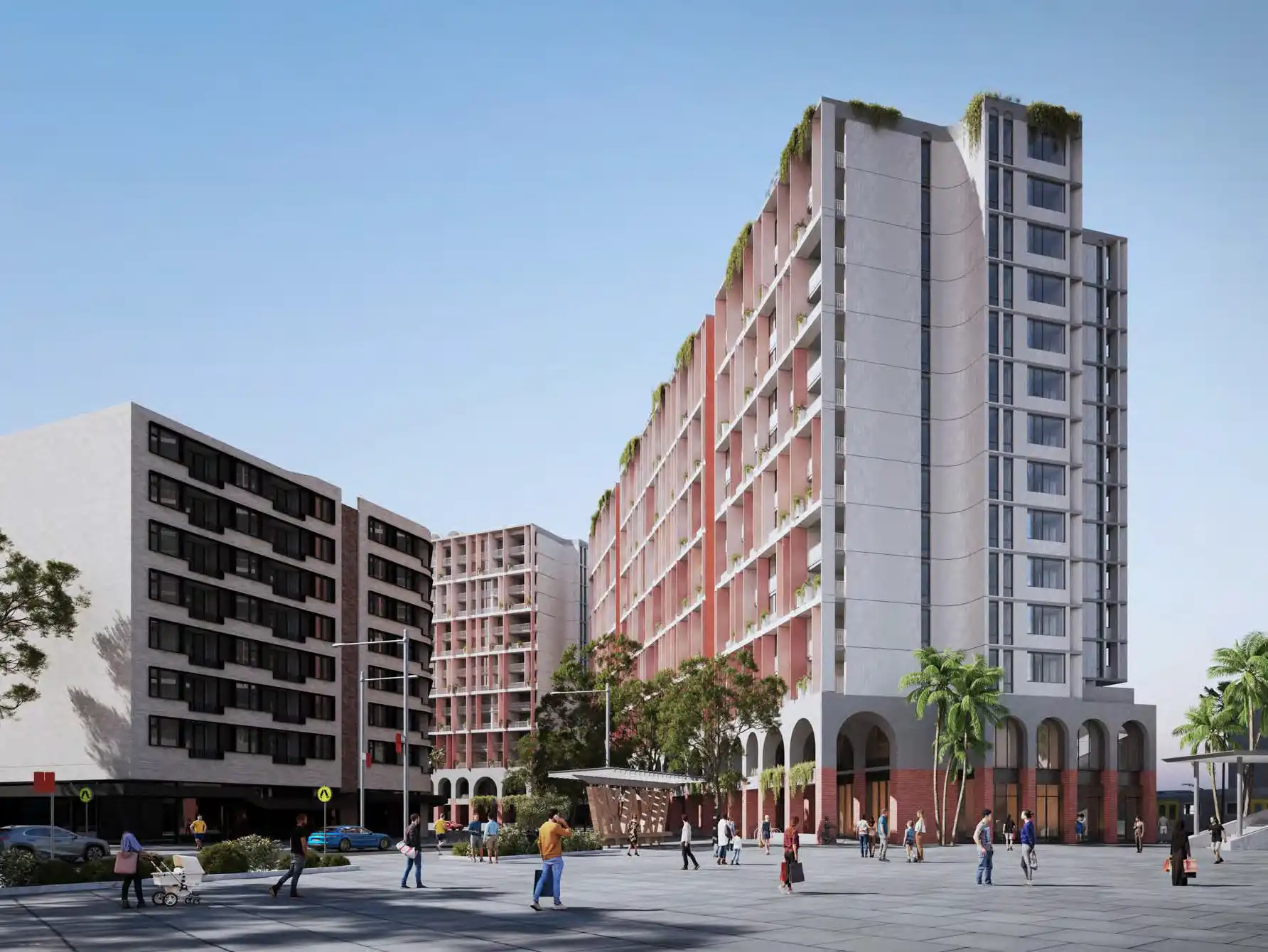 Architectural rendering of a 14-storey mixed-use residential building with a red and white façade, street-level arcades, and landscaped rooftop areas, viewed from a pedestrian plaza.