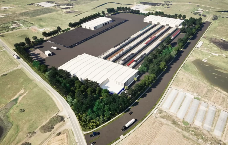Aerial render of Stockland’s approved $62 million vehicle distribution centre at Lot J, Kemps Creek, showing three warehouse buildings, outdoor vehicle racking bays, internal roads, and surrounding landscaping.