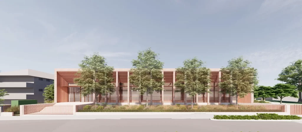 Architectural rendering of Meriden School’s proposed aquatic centre in Strathfield, showing a low-rise building with vertical fins, trees, and landscaped frontage.