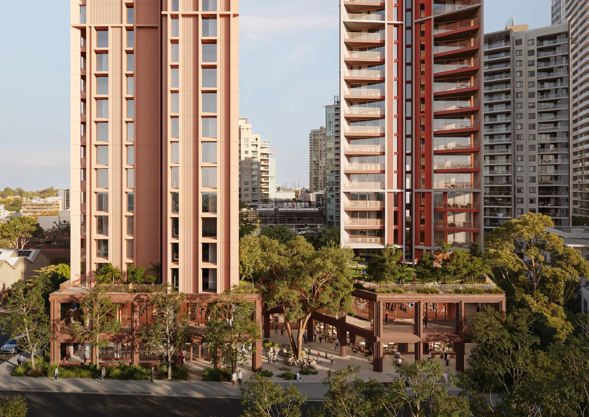 Render of a proposed twin-tower development in Chatswood, showing two high-rise residential buildings with a landscaped podium and active street-level frontage.