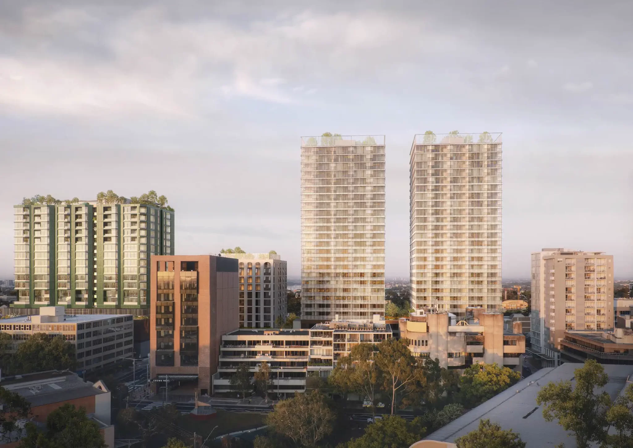 Architectural render of three residential towers above Crows Nest Metro Station, part of a mixed-use over station development.