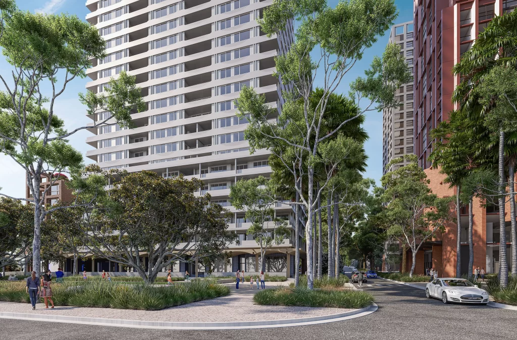 Street-level view of Deicorp’s approved $800 million Five Dock development, showing four residential towers rising above landscaped podiums and tree-lined streets.